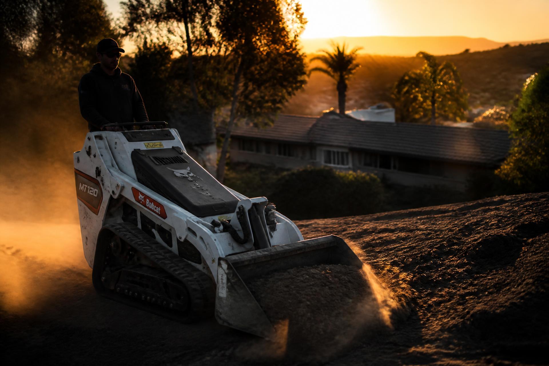 Compact track loader operating on a San Diego County excavation job site